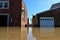 Boat boating down flooded road in Aurora, Indiana