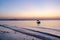 Boat bobbing on the waters of shivrajpur beach, dwarka, gujarat at blue hour dusk