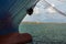 Boat Bow and Rope in Pier, White LightHouse in background