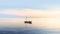 Boat on a calm blue lake with blue sky