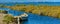 Boat on a Canal in Ebro Delta estuary and wetlands, Tarragona, Catalunya, Spain.