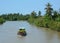 Boat carrying flowers on river in Can Tho, Vietnam