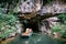 Boat cave tour in Trang An Scenic Landscape formed by karst towers and plants along the river (UNESCO World Heritage Site). It\'s