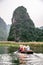 Boat cave tour in Trang An Scenic Landscape formed by karst towers and plants along the river (UNESCO World Heritage Site). It\'s