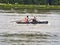 Boat coxed rowers rowing on the Seine river during Armada parade in France