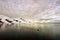 Boat cruising through Neumayer Channel in Antarctica