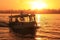 Boat cruising the Nile river at sunset, Luxor