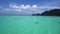 Boat cruising through tropical paradise ocean turquoise sea and blue sky Phuket Thailand