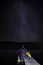 Boat dock under a starry sky