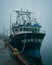 Boat docked at the harbor on a foggy night, St. Johns, Newfoundland and Labrador, Canada