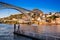 Boat and the Dom Luis I Bridge a metal arch bridge over the Douro River between the cities of Porto and Vila Nova de Gaia