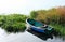 Boat on an empty lake. Landscape with reeds and reflection