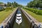 Boat entering gateway sluice locks on the Augustow Canal, Poland