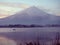 Boat with fisherman floating on lake kawaguchi on morning time w