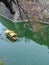 The boat floated in the canals around the Osaka castle with branches of Sakura cherry blossom tree for background