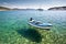 Boat floating on crystal waters, Tisno, Croatia