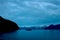 Boat Floating on Ocean Landscape with Blue Midnight Alaskan Light