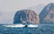 Boat floating on seaside surrounded by desert rocks near Khasab Oman