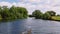 Boat footage of trees and reeds blowing on a windy day