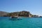 A boat in front of Spinalonga island