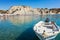 Boat in front of umbrellas, sunbeds on Kolymbia beach Rhodes, G