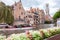 Boat full of tourists in the water canal of Bruges in Belgium