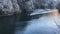 Boat goes by the river in Matka Canyon in Skopje