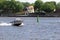 Boat and the green high buoy under water