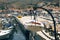 Boat hanging on the chain on the dock of the island of Hydra, Gr