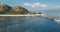 Boat harbor at island with paradise resort aerial. Water transport at ocean shore. Nature seascape