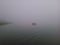 Boat in the haze of foggy weather