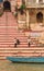 Boat and historic steps at the Chousati Ghat in Varanasi