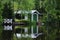 Boat house reflecting on lake