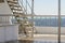 Boat ladder, Deck on the stern of the yacht on a sunny day and beautiful blue sea water.