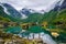 Boat on the lake on a background of mountains and glacier. Norway. Beautiful landscape