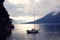 Boat on Lake Como at the sunset. Silver linings.