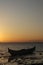 Boat in the lake at sunset. Rowing boat floating over the Limboto Lake waters. Gorontalo, Indonesia