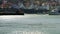 A boat leaves the harbour in Staithes a small fishing village near to Scarborough, North Yorkshire.