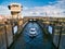 A boat leaves one of the three locks at Cardiff Barrage in Cardiff, Wales, UK.