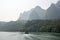 Boat on Li river cruise and karst formation mountain landscape in Guilin