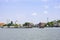 A boat load of sand in Chao Phraya River Background cityscape and sky at Pak kret in Nonthaburi , Thailand. April 16, 2019