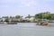 A boat load of sand in Chao Phraya River Background cityscape and sky at Pak kret in Nonthaburi , Thailand. April 16, 2019