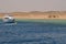 Boat and many snorkelers in the sea