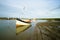 Boat moored at low tide.