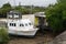 Boat Moored At Low Tide Beside Beach Shack