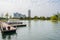 Boat moored at small offshore planked floating dock in cloudy wi