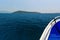 Boat off the coast of the Mediterranean. Mountains and Islands on the horizon after a long journey