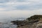 Boat Off the Rocky Coast of Monterey CA.