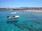 Boat over clear water on Crete coast, Greece