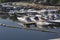 Boat parking in modern city river harbor, yachts, jetty.